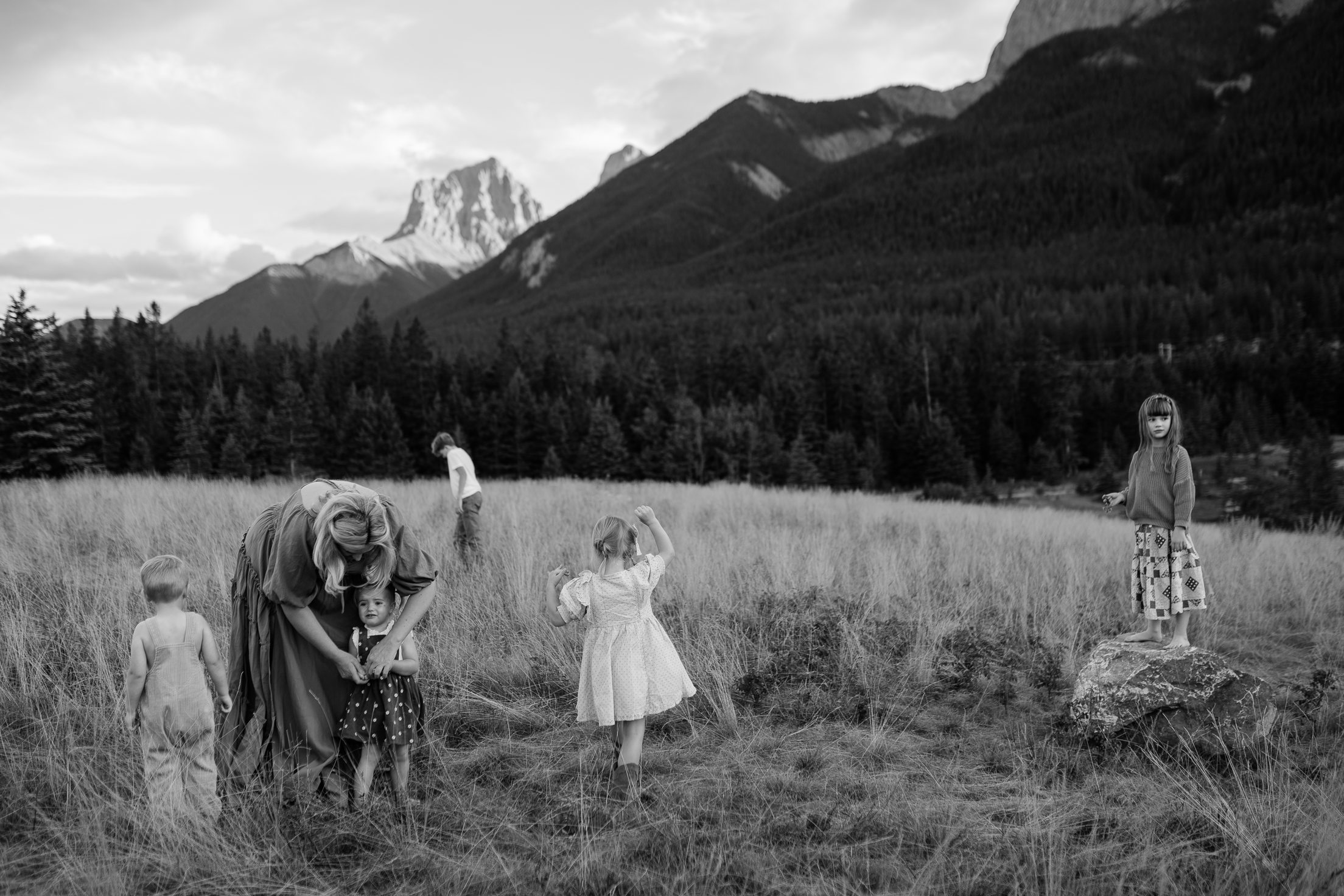 Mother in the Canadian mountains with her five children exploring.