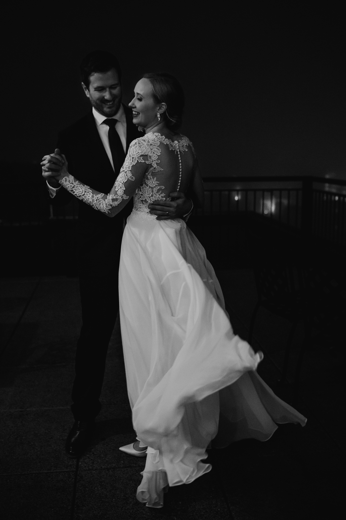 Bride and groom dancing on the Edgewater Hotel rooftop during their Madison Micro Wedding.