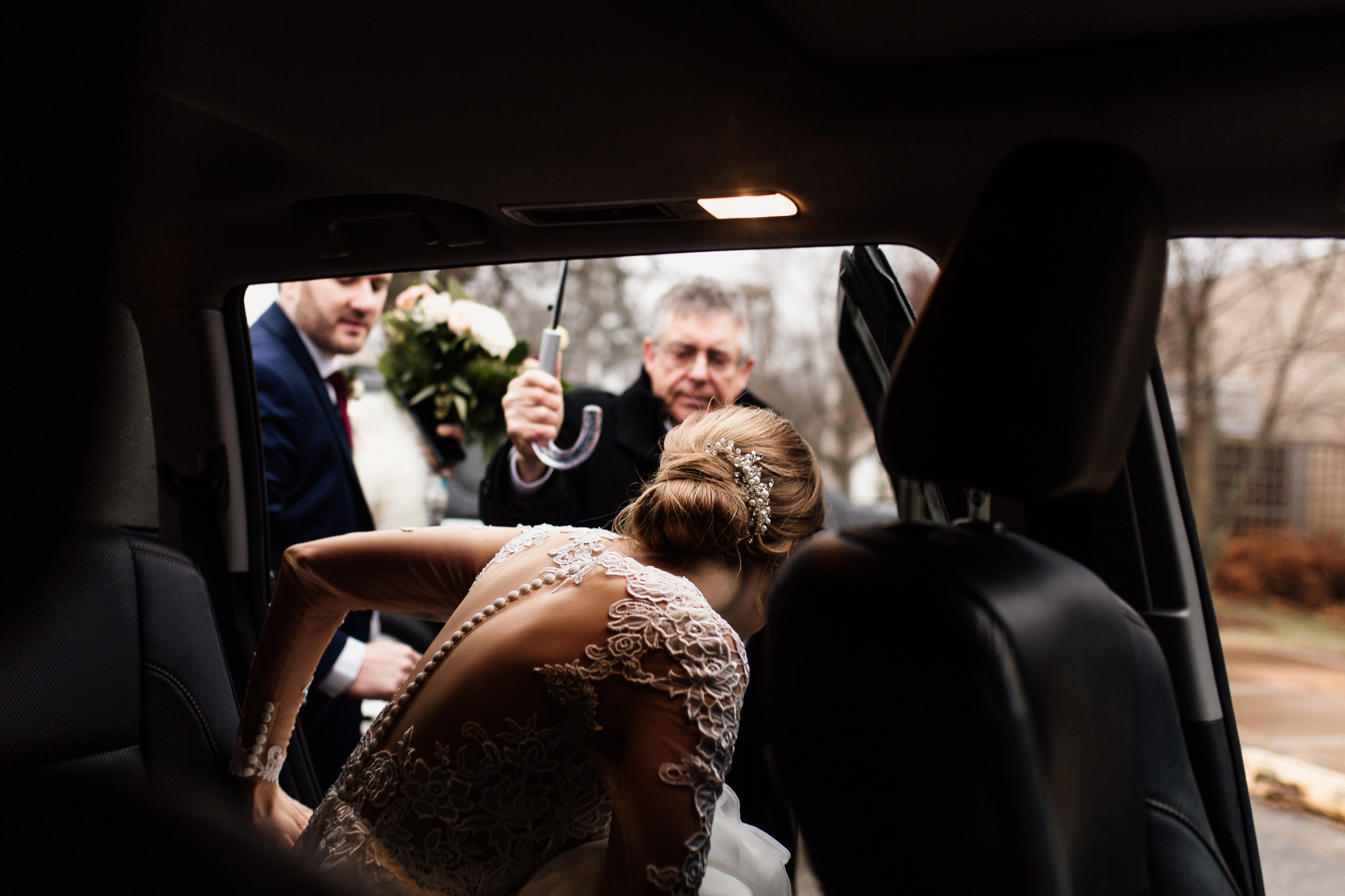 Bride getting out the car on her way to the wedding ceremony.
