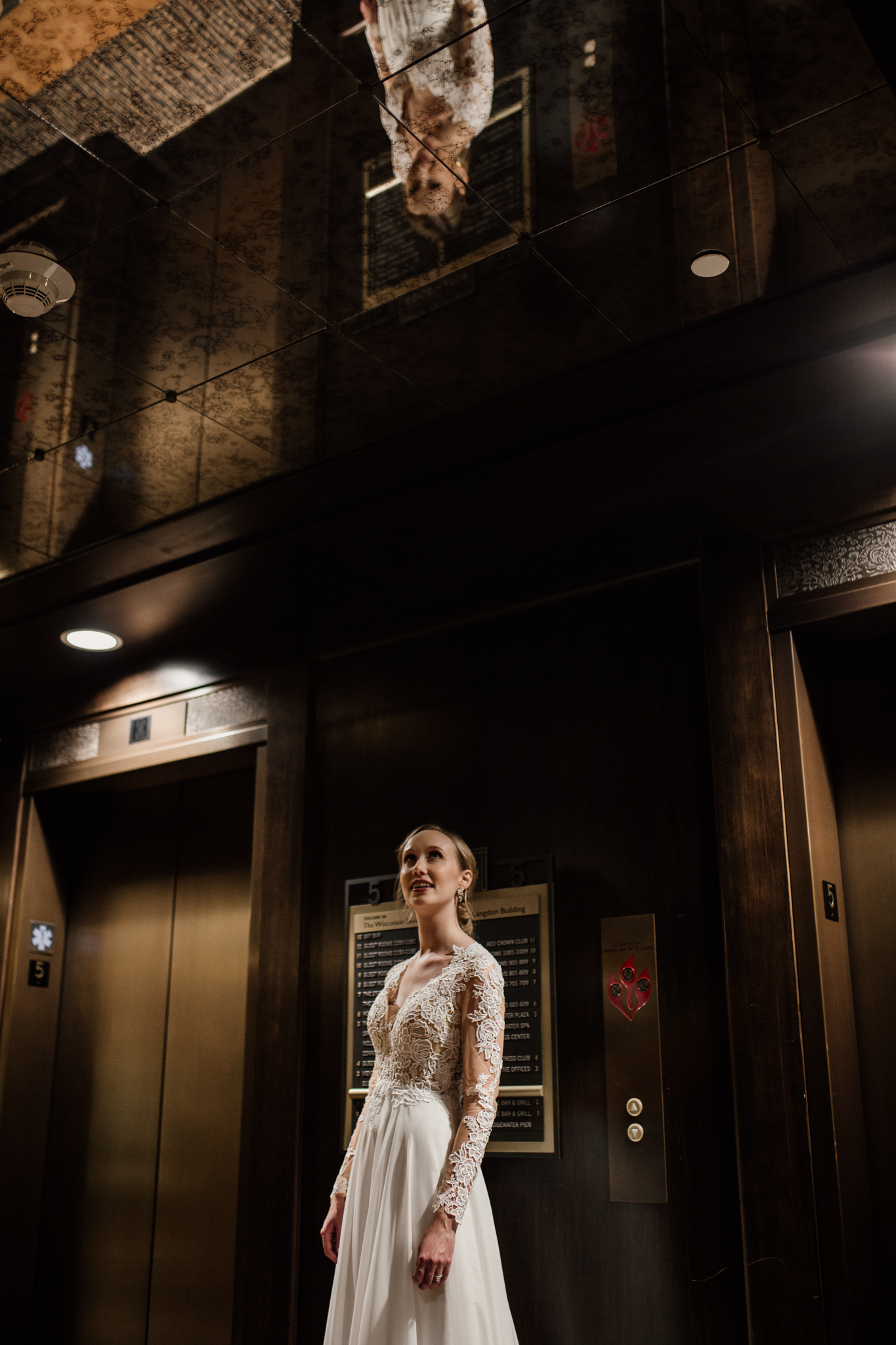 Bride in the elevator hallway at the Edgewater Hotel Madison.