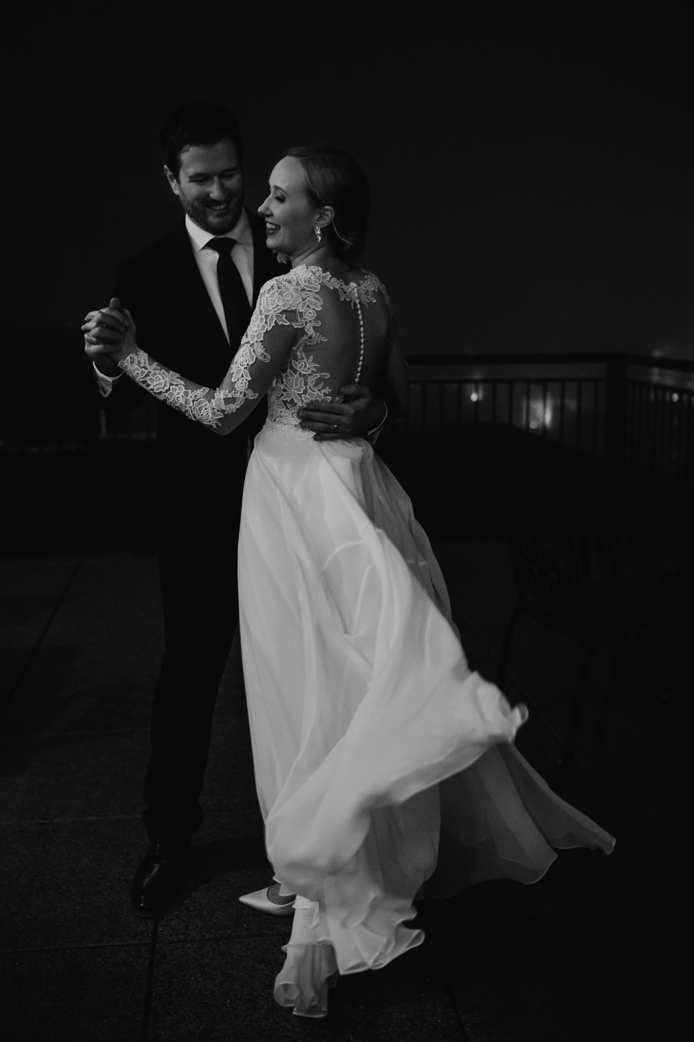 Bride and groom dancing on the Edgewater Hotel rooftop.